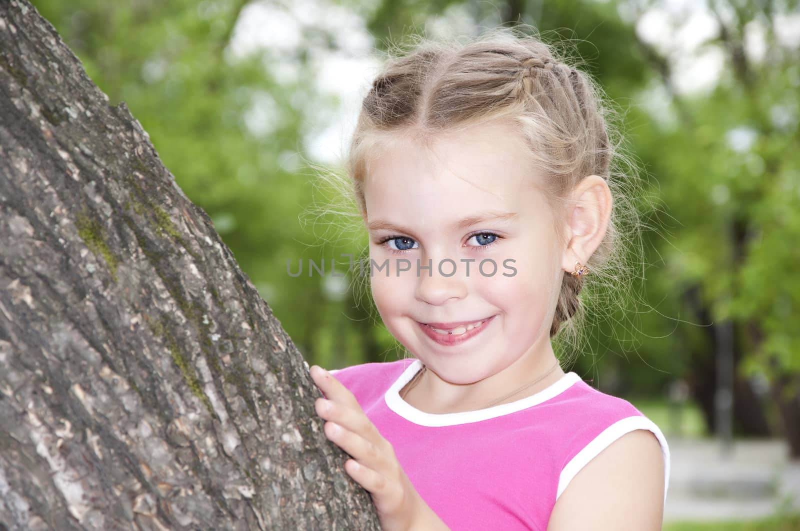 Girl peeping out through tree by adam121