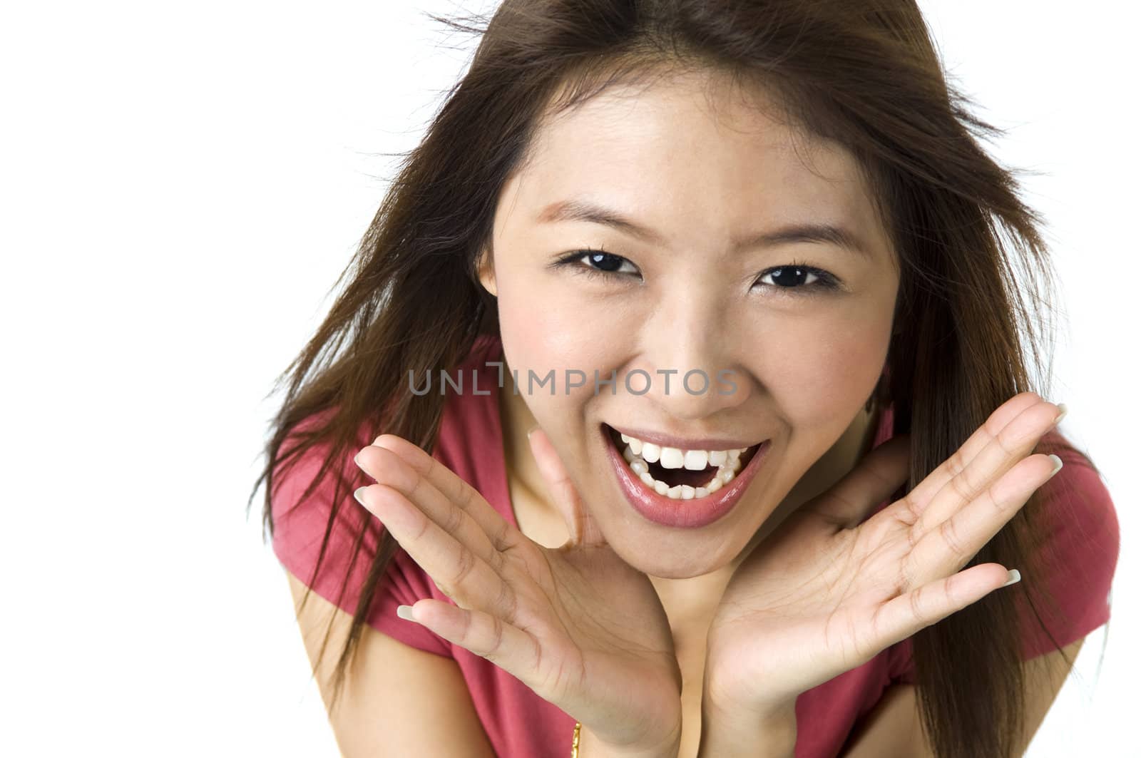 Asian young woman looking surprised against white background.
