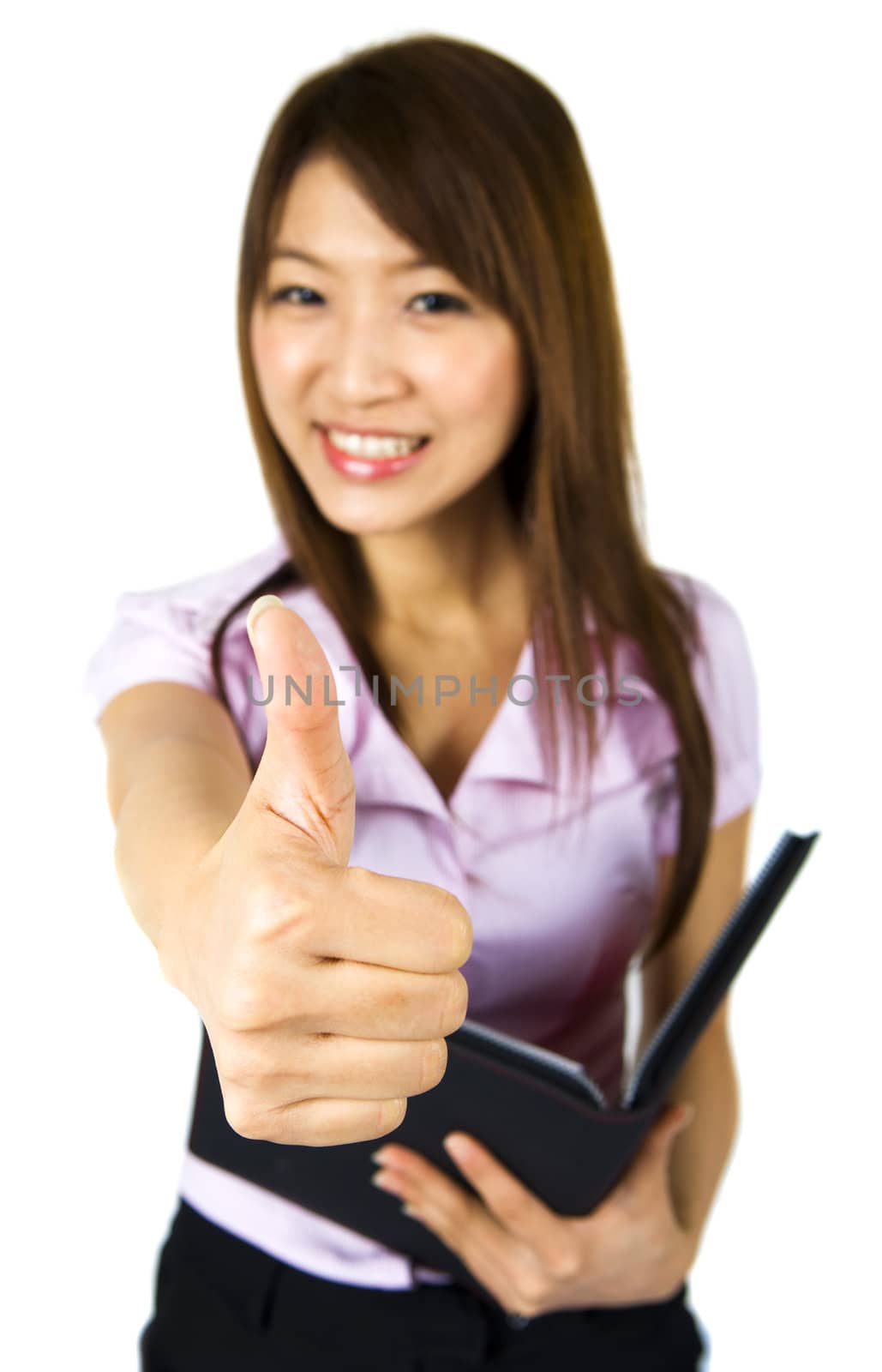 An Asian girl giving thumbs up sign and holding a file isolated on white.