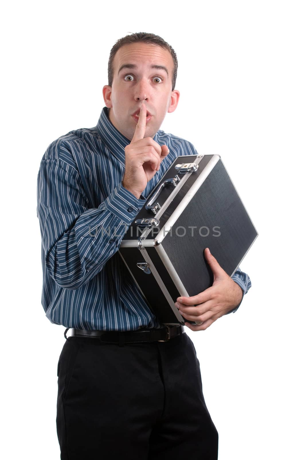 A young employee is sneaking away a case of private documents and telling the viewer to be quiet, isolated against a white background