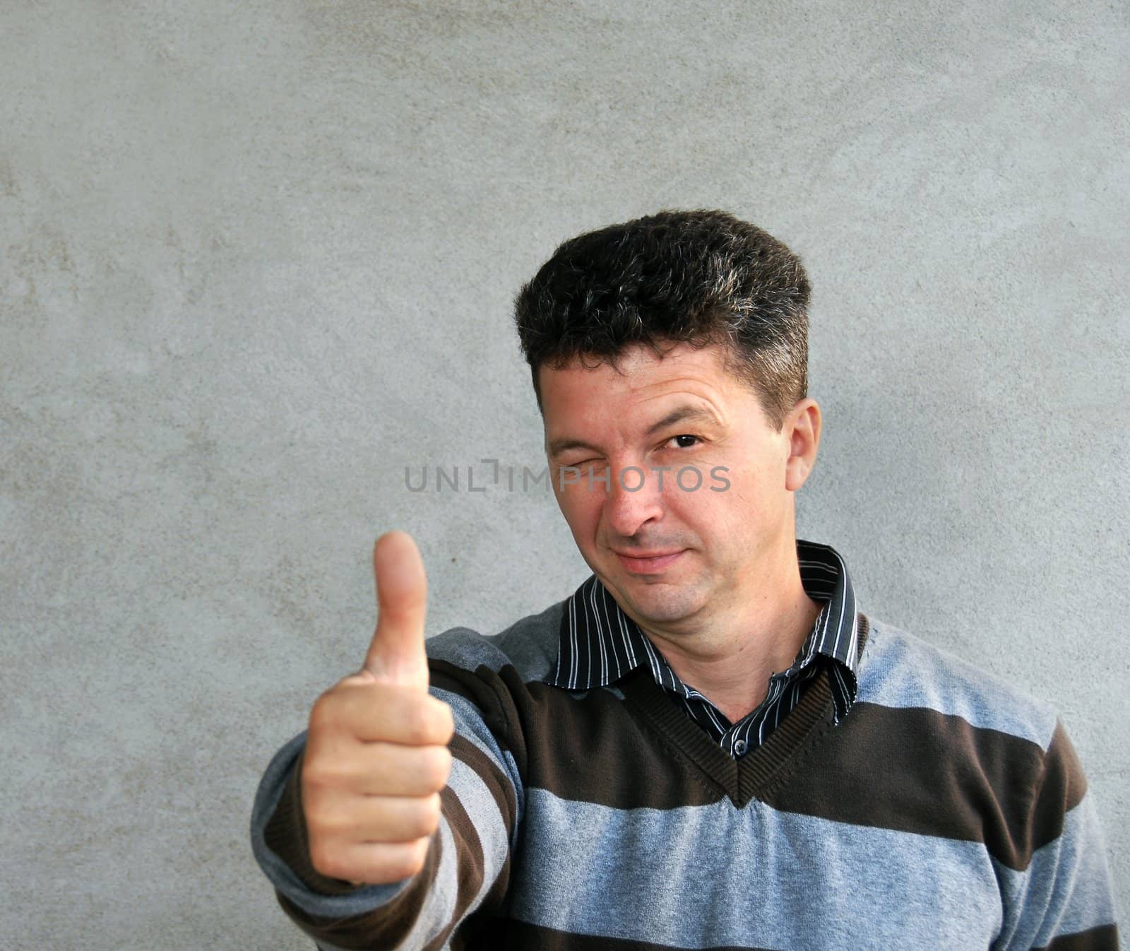 portrait of adult caucasian mature man showing ok sign