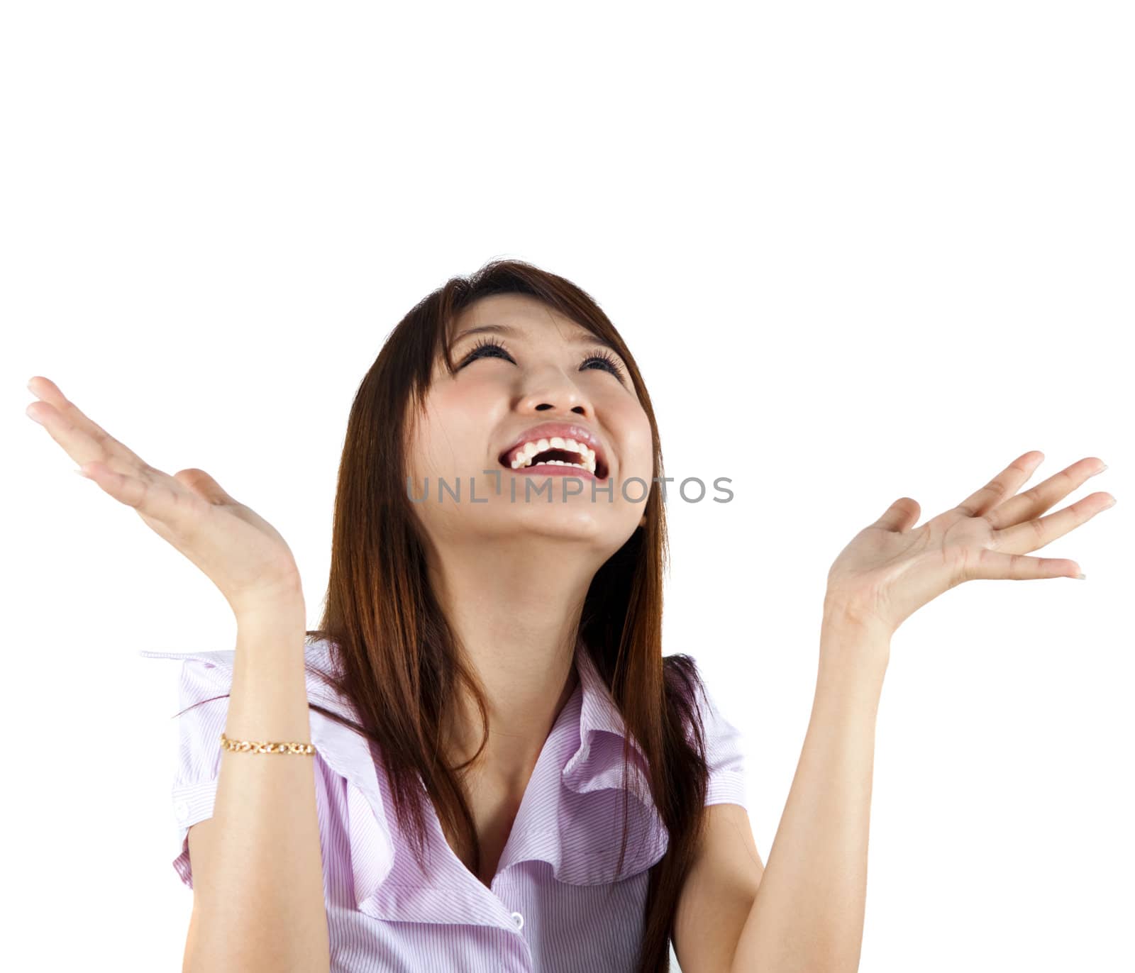 Happy Asian woman looking up and arms out, isolated on white.