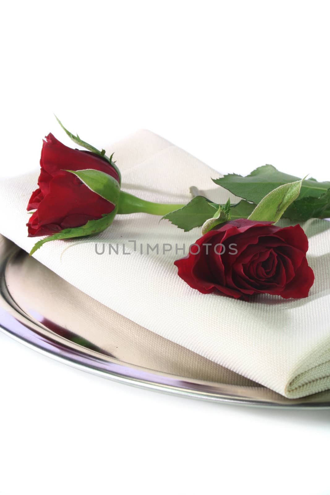 two roses on a tray