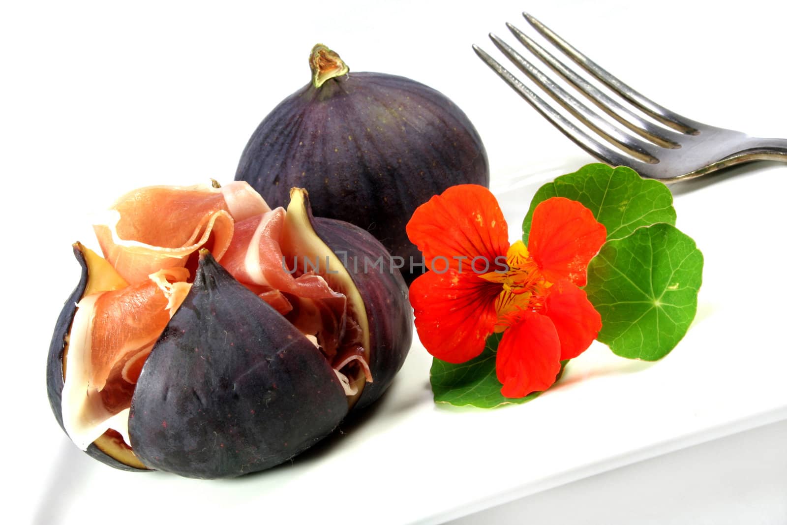 Figs with Serrano ham and nasturtiums
