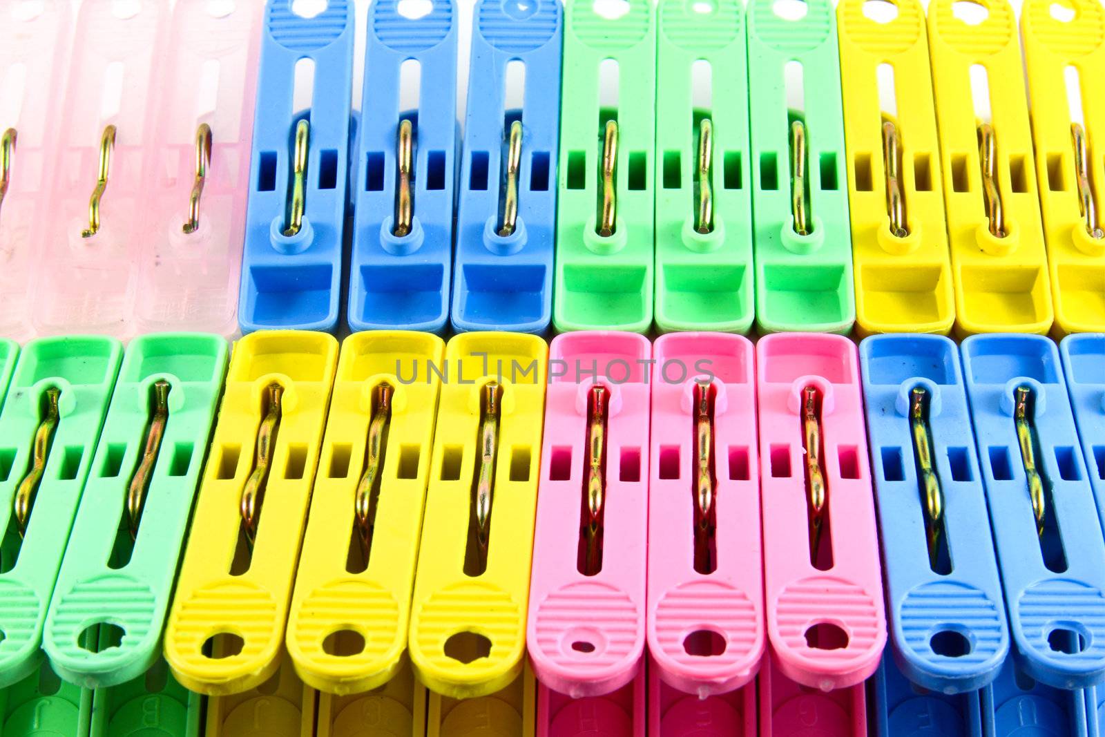 stack of colorful clothes pins