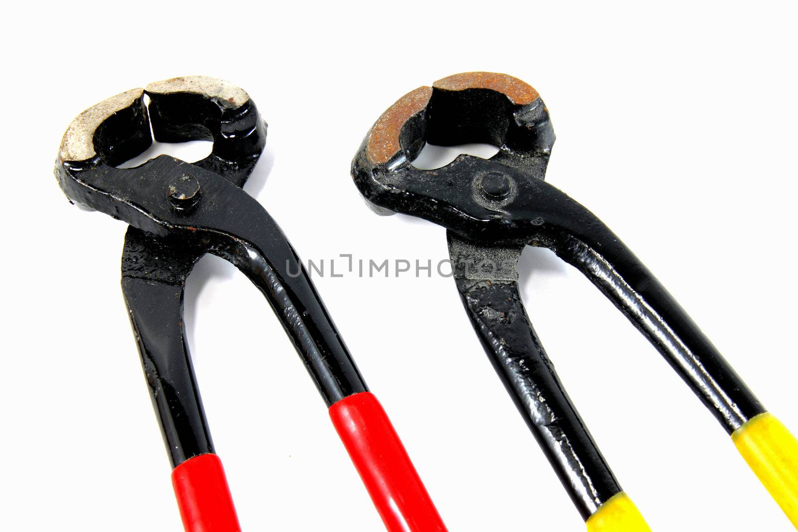 a pair of pliers on white background