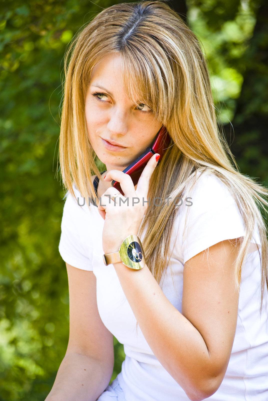 beautiful young woman talking on phone by Dessie_bg