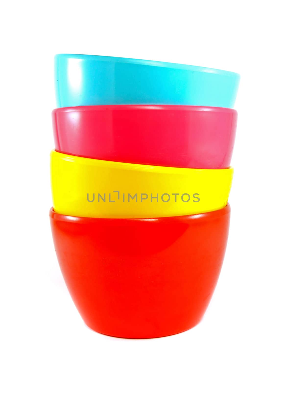 Stack of colorful plastic bowl by nuchylee