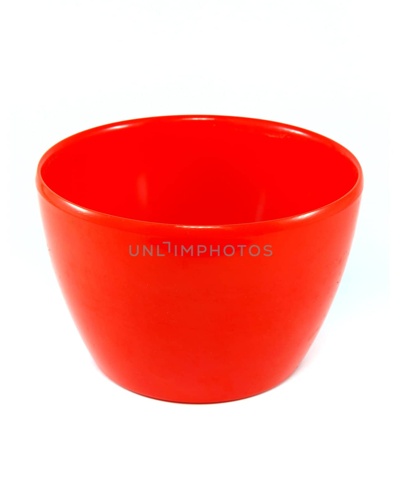 Red empty plastic bowl isolated on white