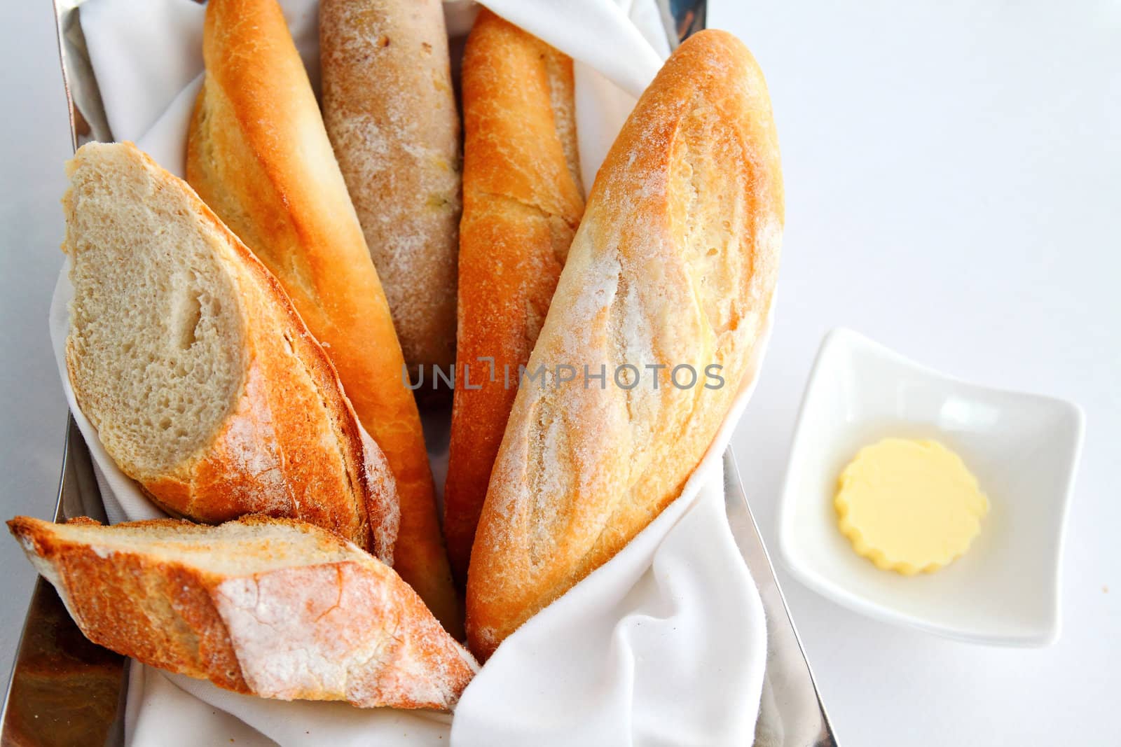 Sliced baguette with butter