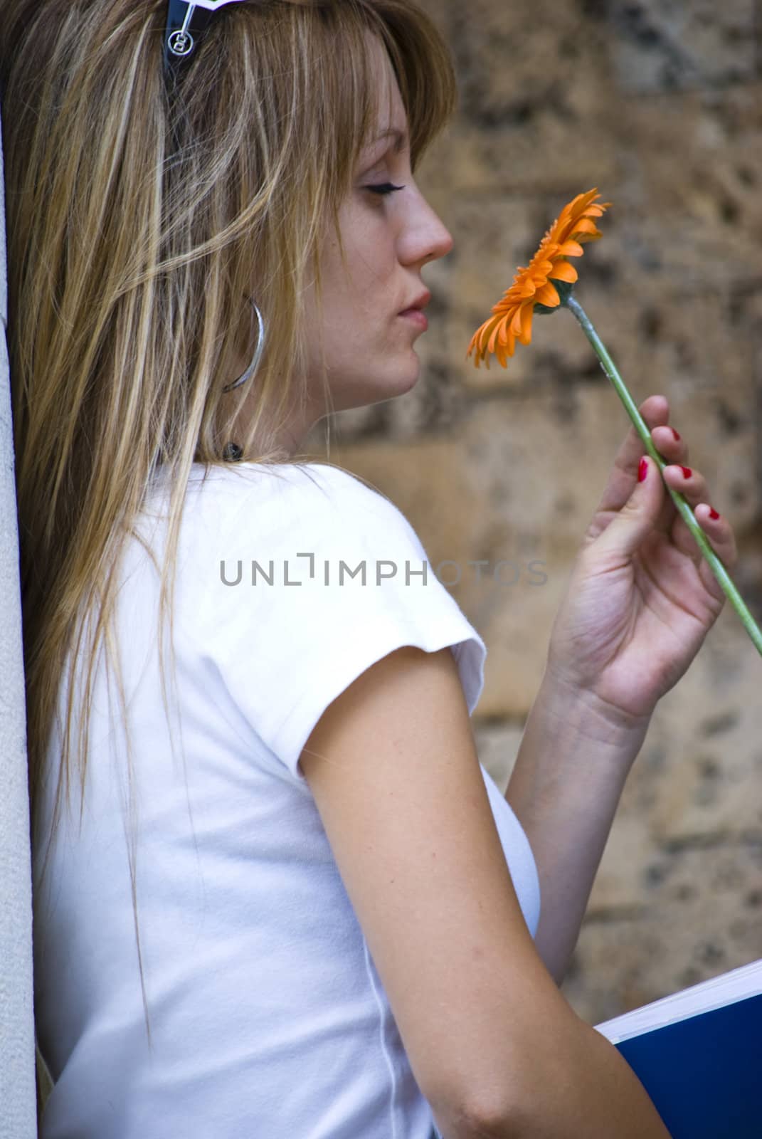 beautiful young blonde woman with flower