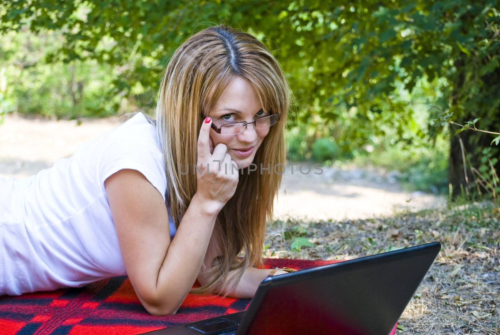 beautiful young woman working out with laptop or notebook