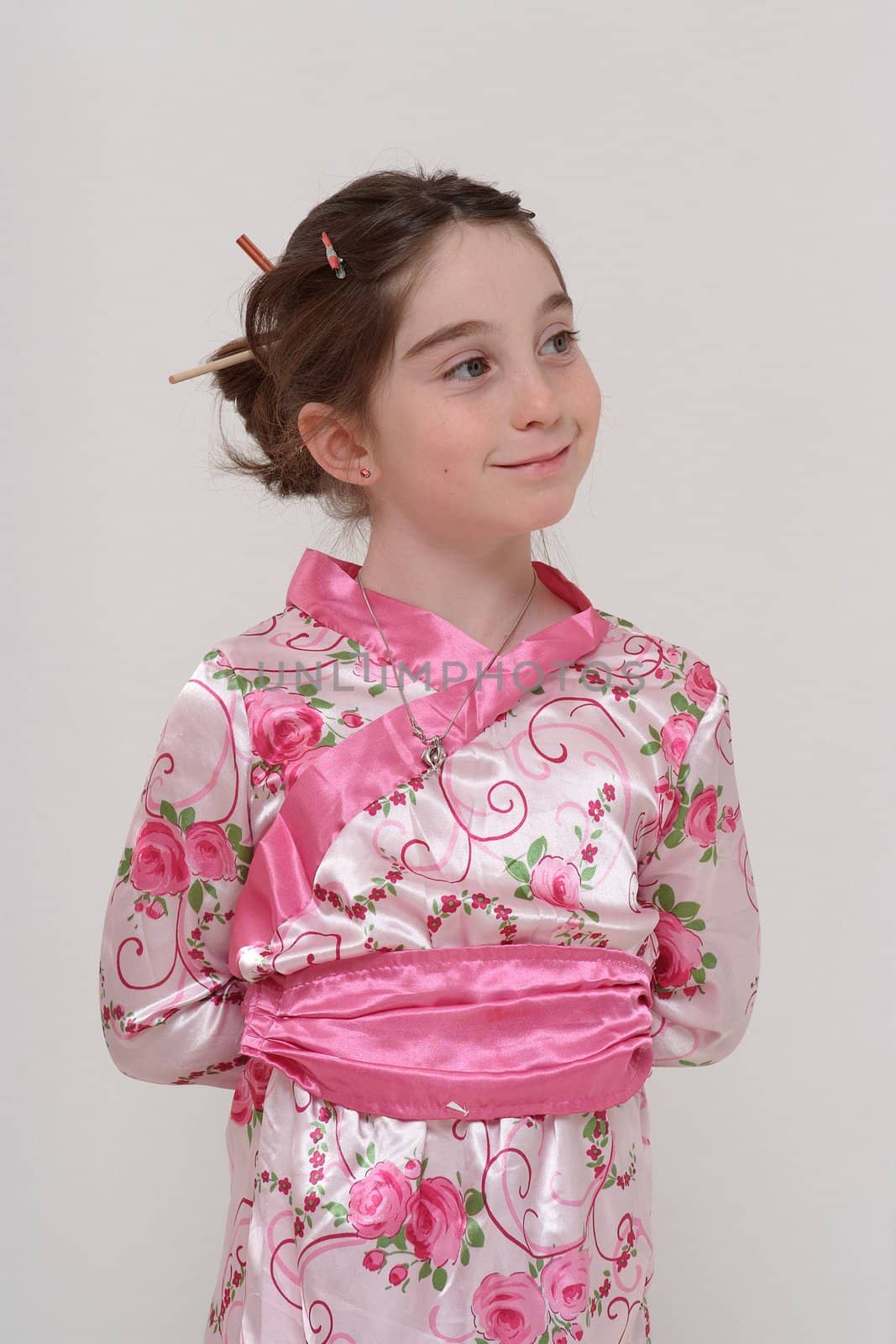 Cute smiling girl in Japanese masquerade costume