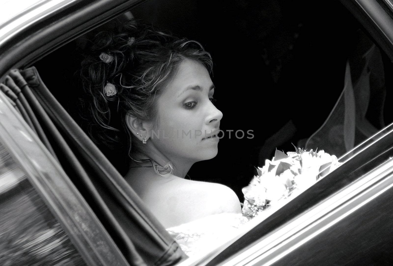 Bride in wedding car limousine