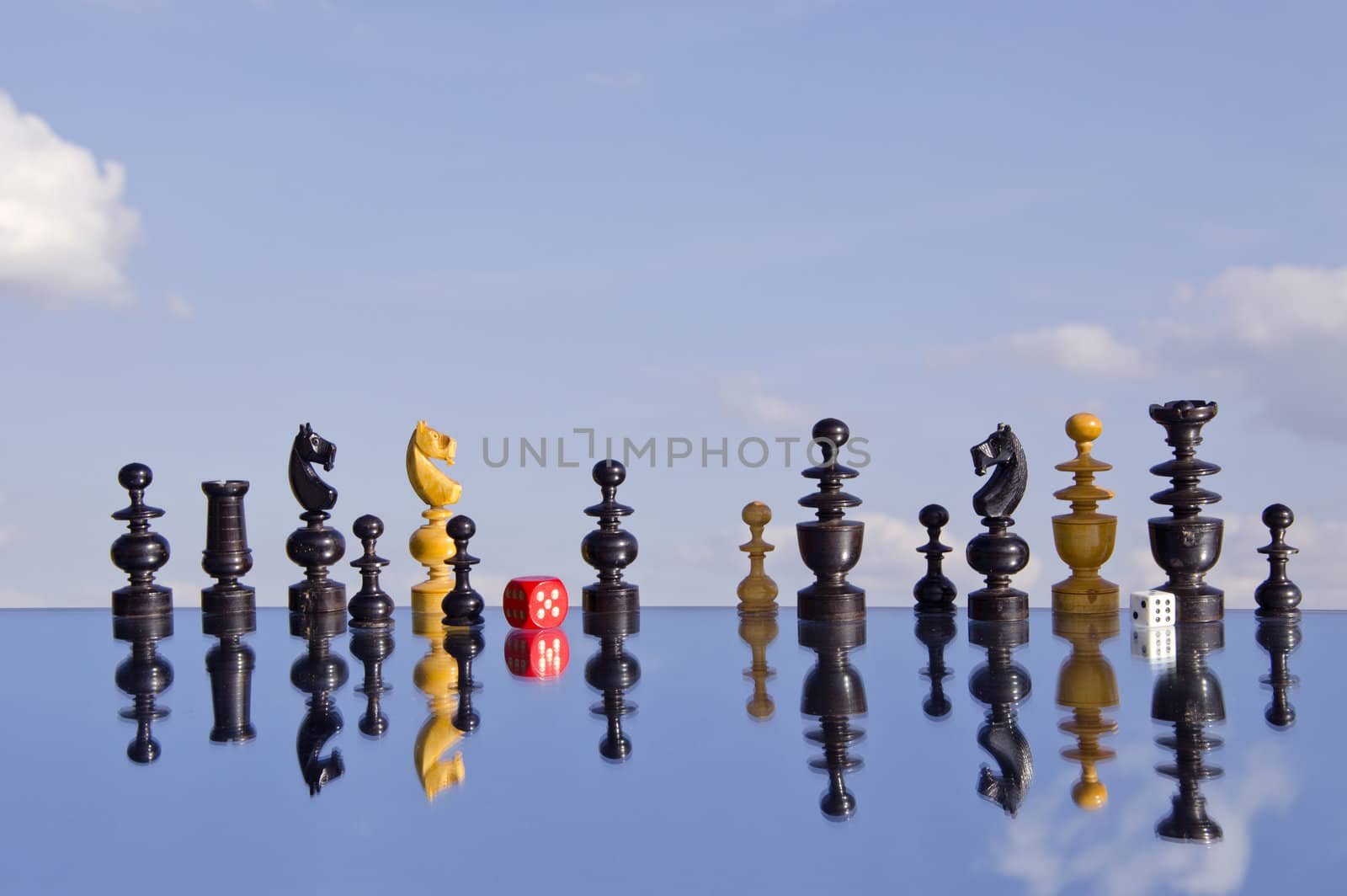 vintage chessmans  and red dice on mirror by alis_photo