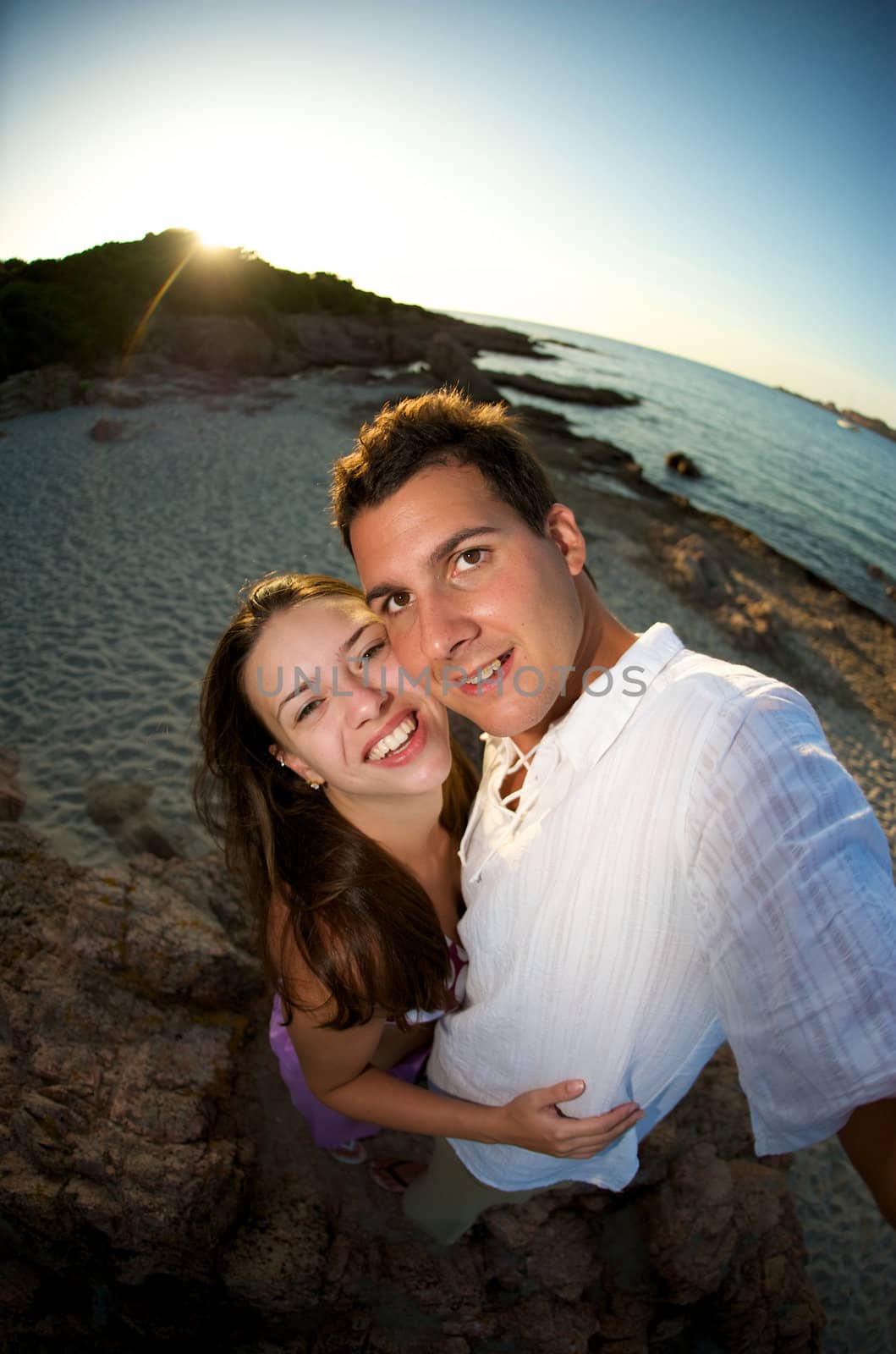 Lovely couple enjoying the sunset during their vacation