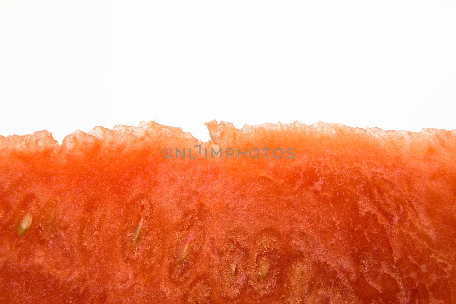 fresh red watermelon isolated over white looking like poland or indonesia or reversed monaco
