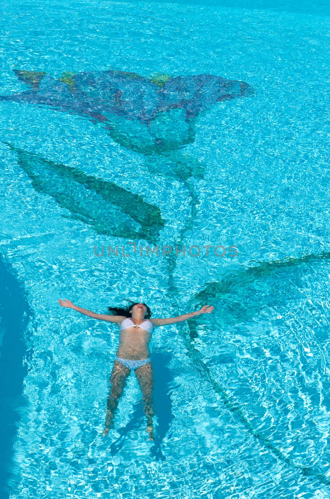 Woman relaxing in the spa swimming pool