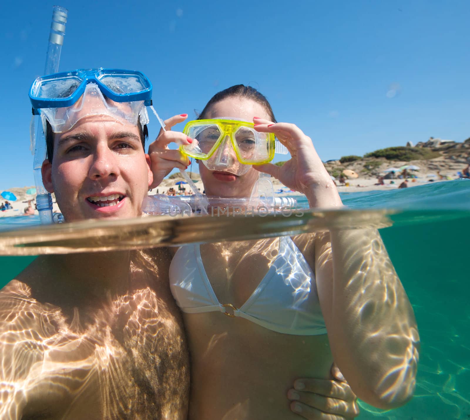 Lovely couple enjoying snorkeling during their vacation