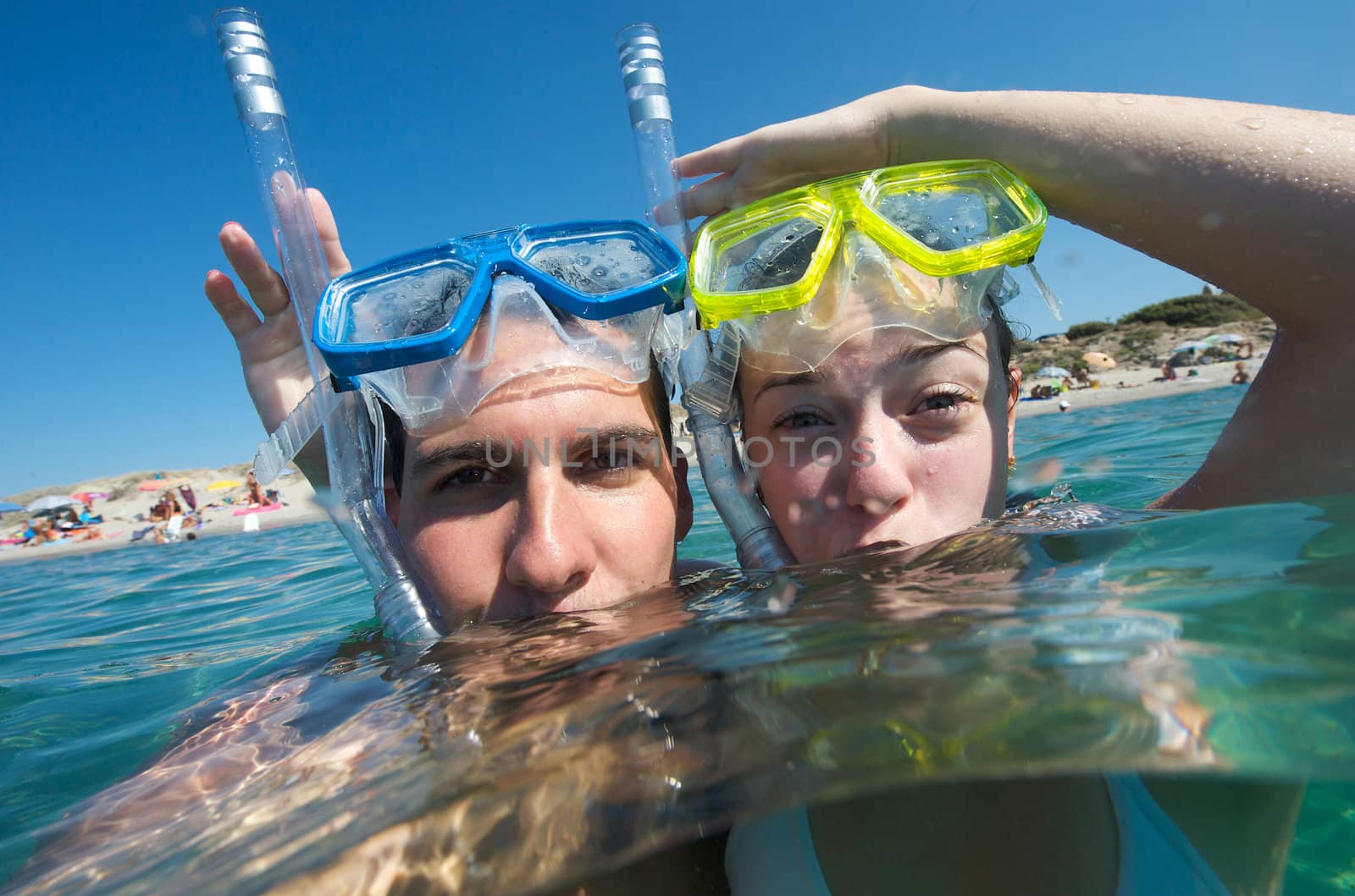 Lovely couple enjoying snorkeling during their vacation