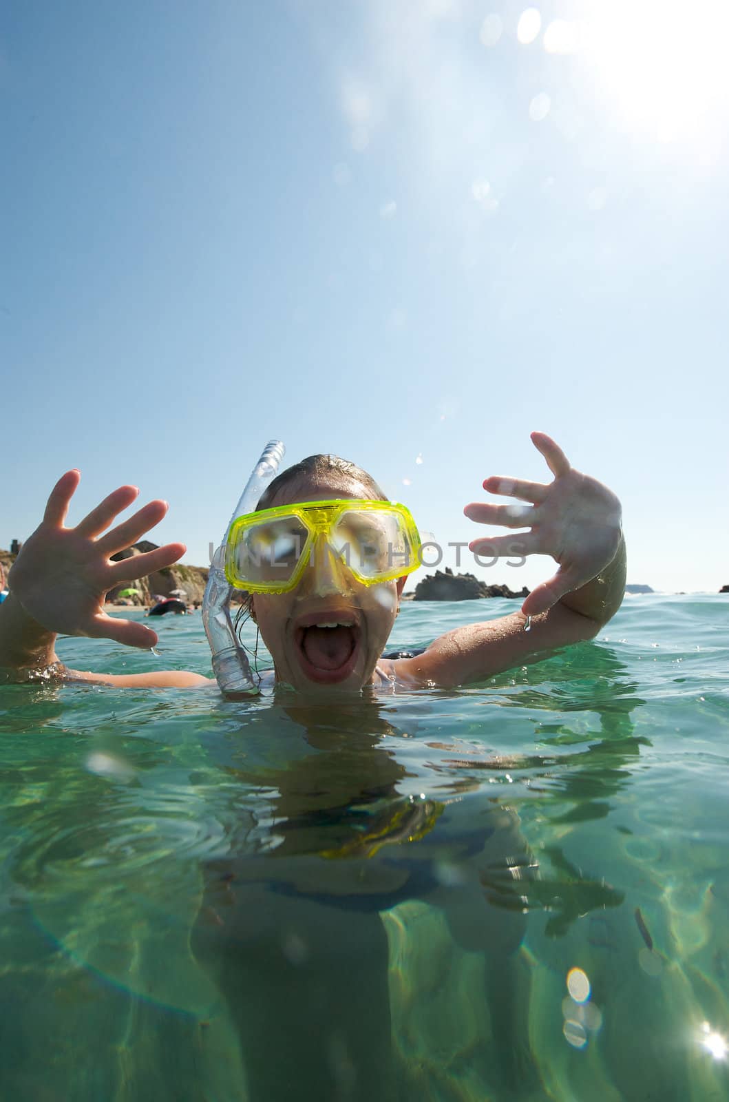 Woman doing snorkeling with goggles and scuba