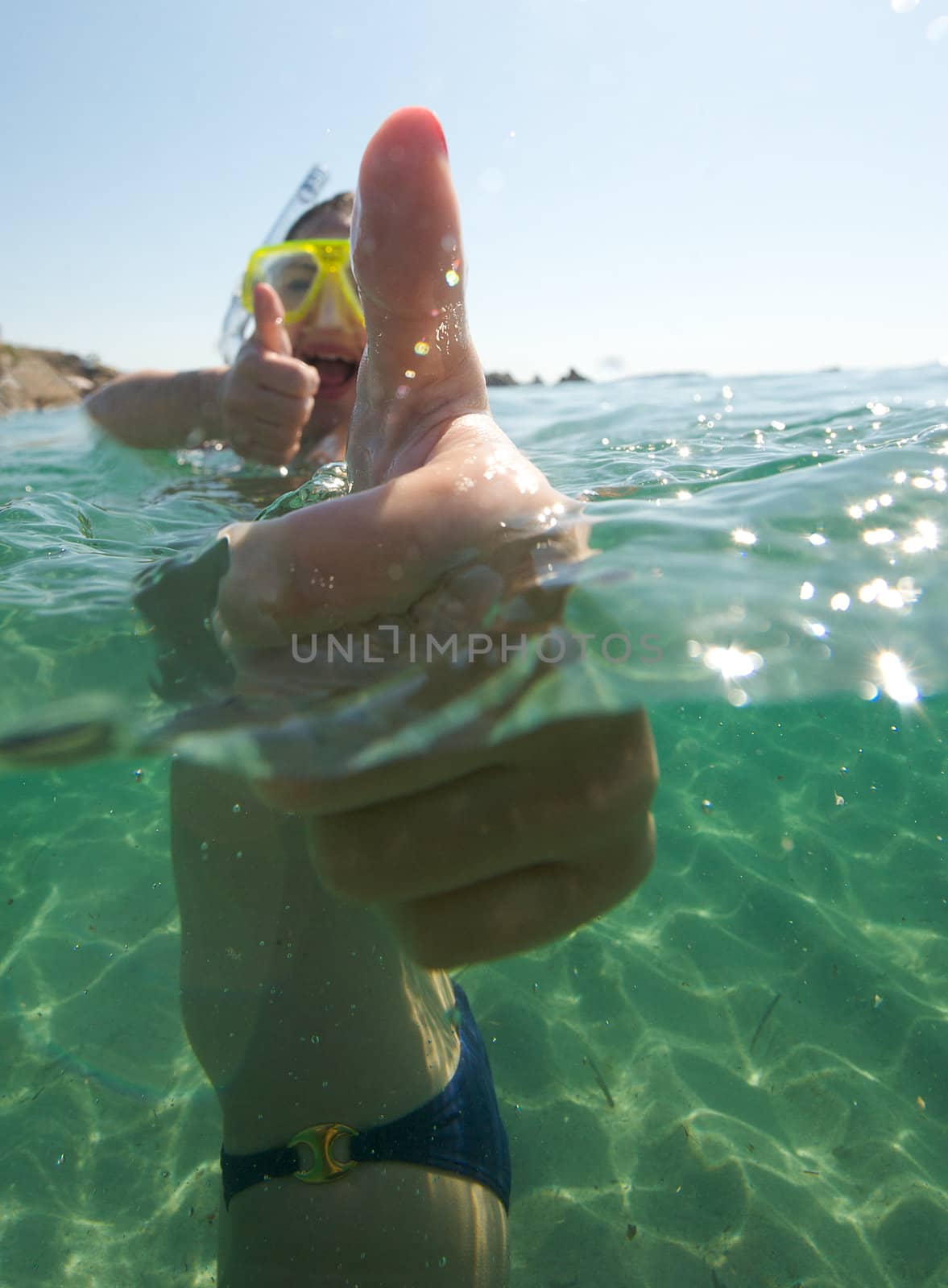 Woman doing snorkeling with goggles and scuba