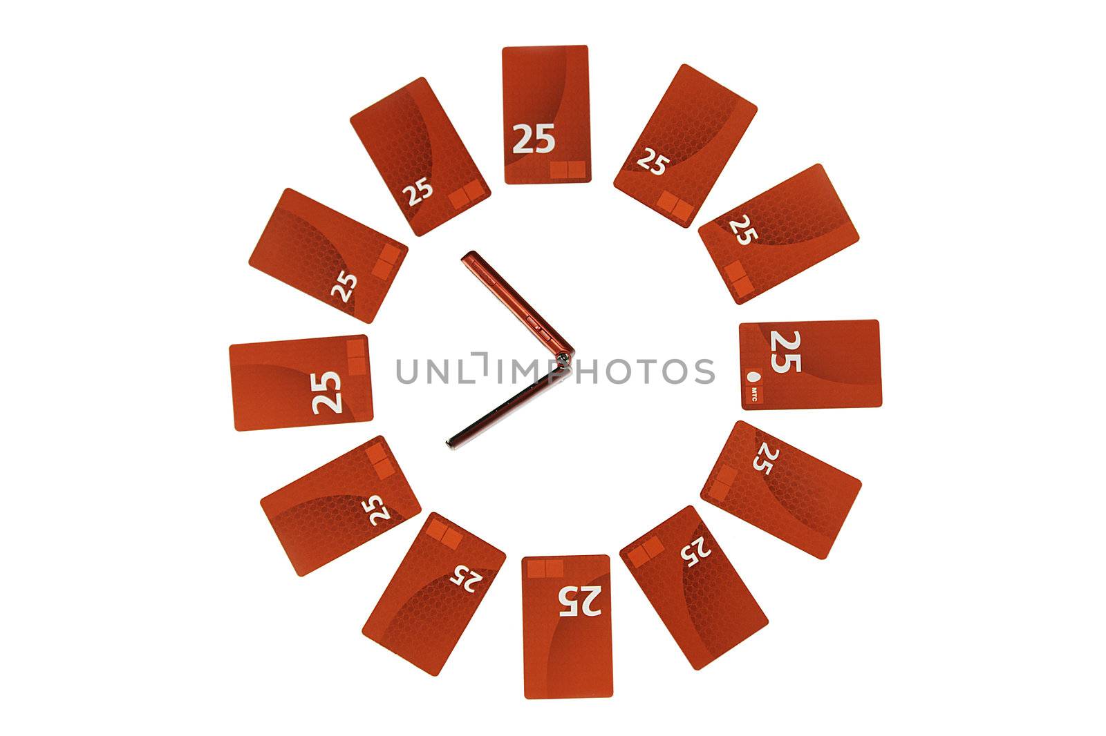 conceptual clock maked from recharge cards and red mobile