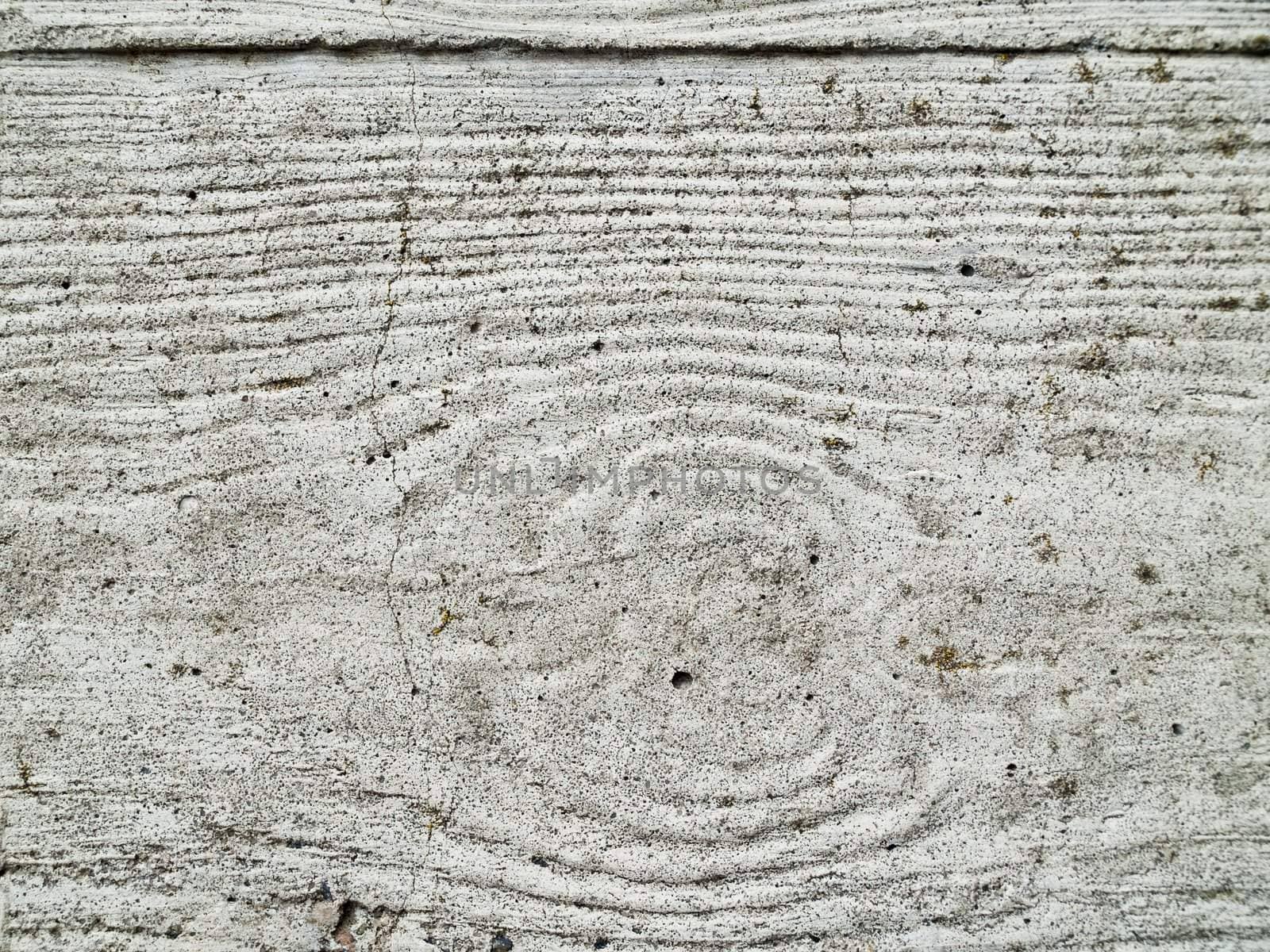 A textured patterned wall of concrete. Copyprint of wood.