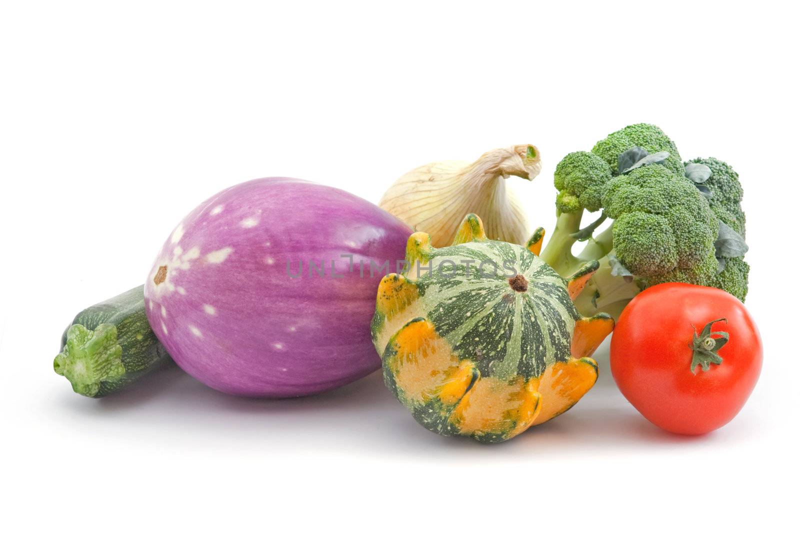 several different fresh vegetables on white background