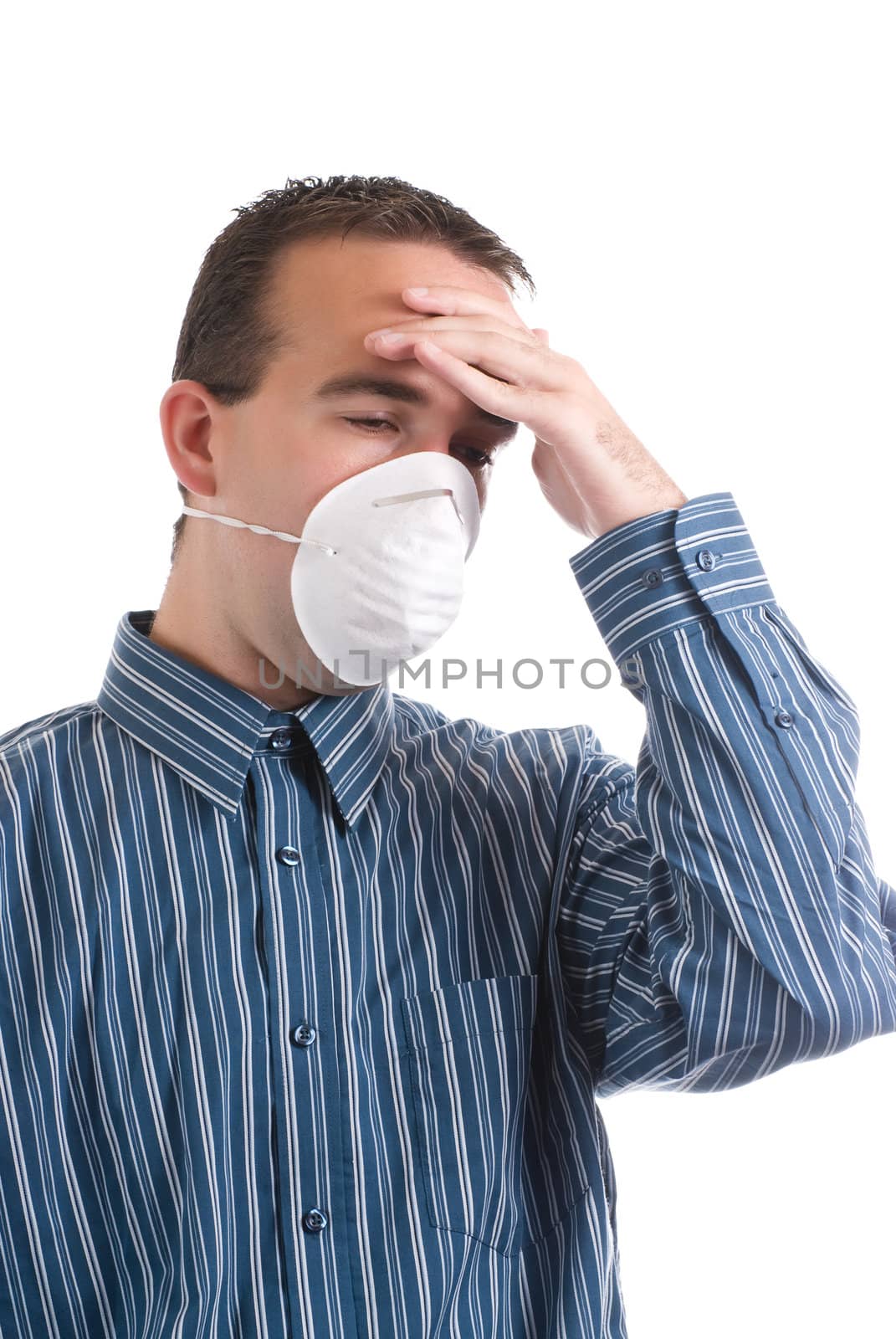 A young man with a respiratory infection is wearing a mask to protect others and is suffering from a headache, isolated against a white background