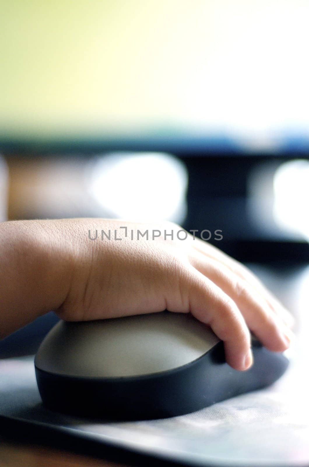 Close-up of girls hand on computer