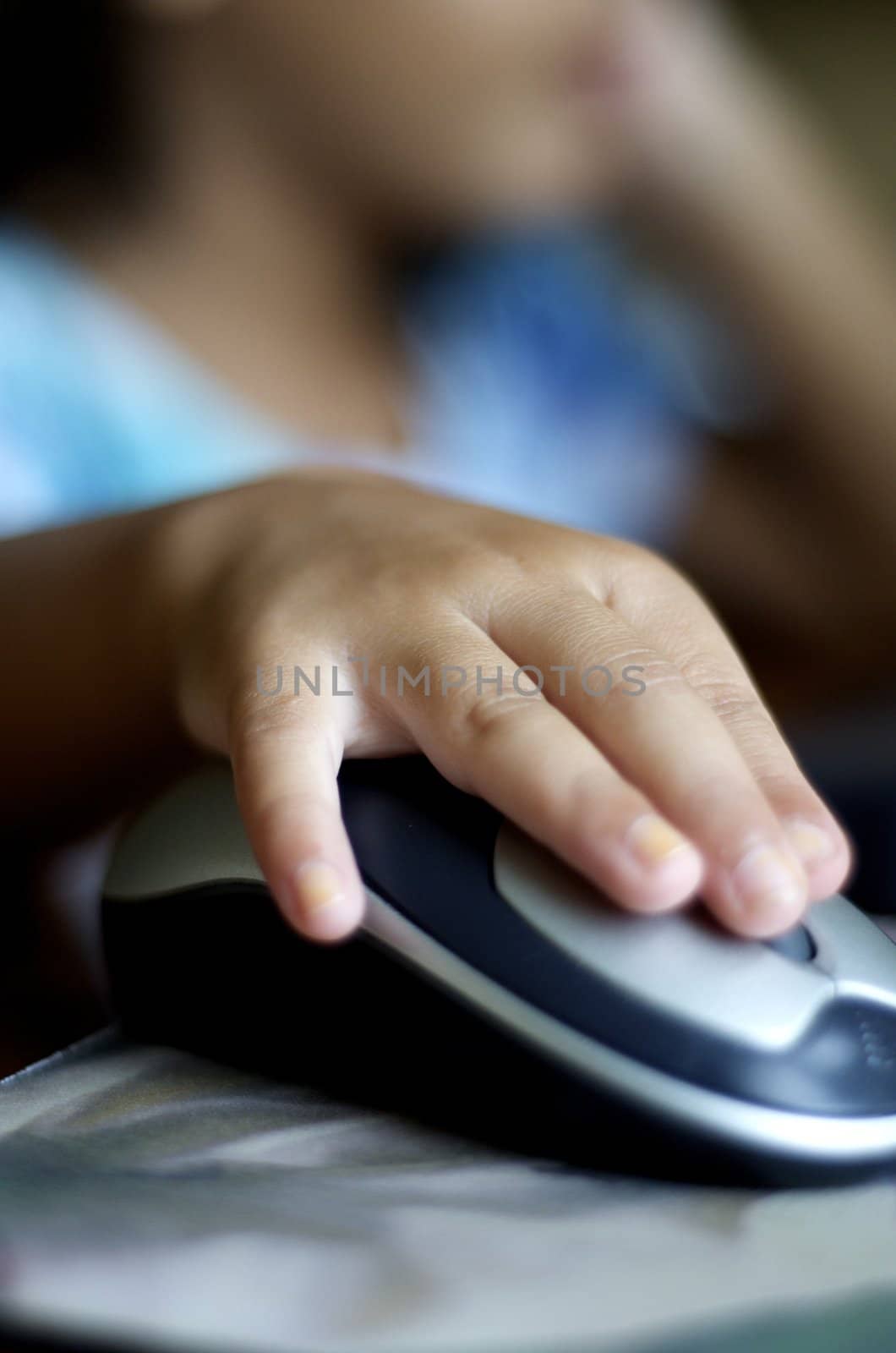 Close-up of girls hand on computer