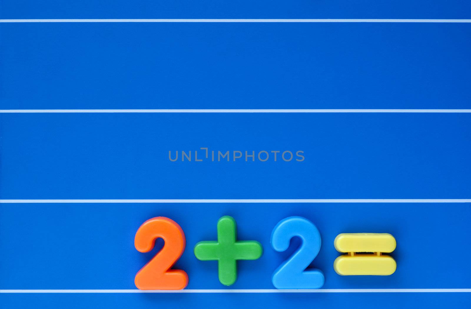 A sum, from a child's toy number set, placed at bottom right of a blue, lined background. Space for text top left.