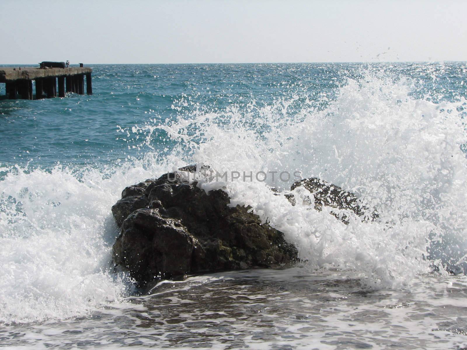 cold sea waves crashing against the coast stone by acidgrey