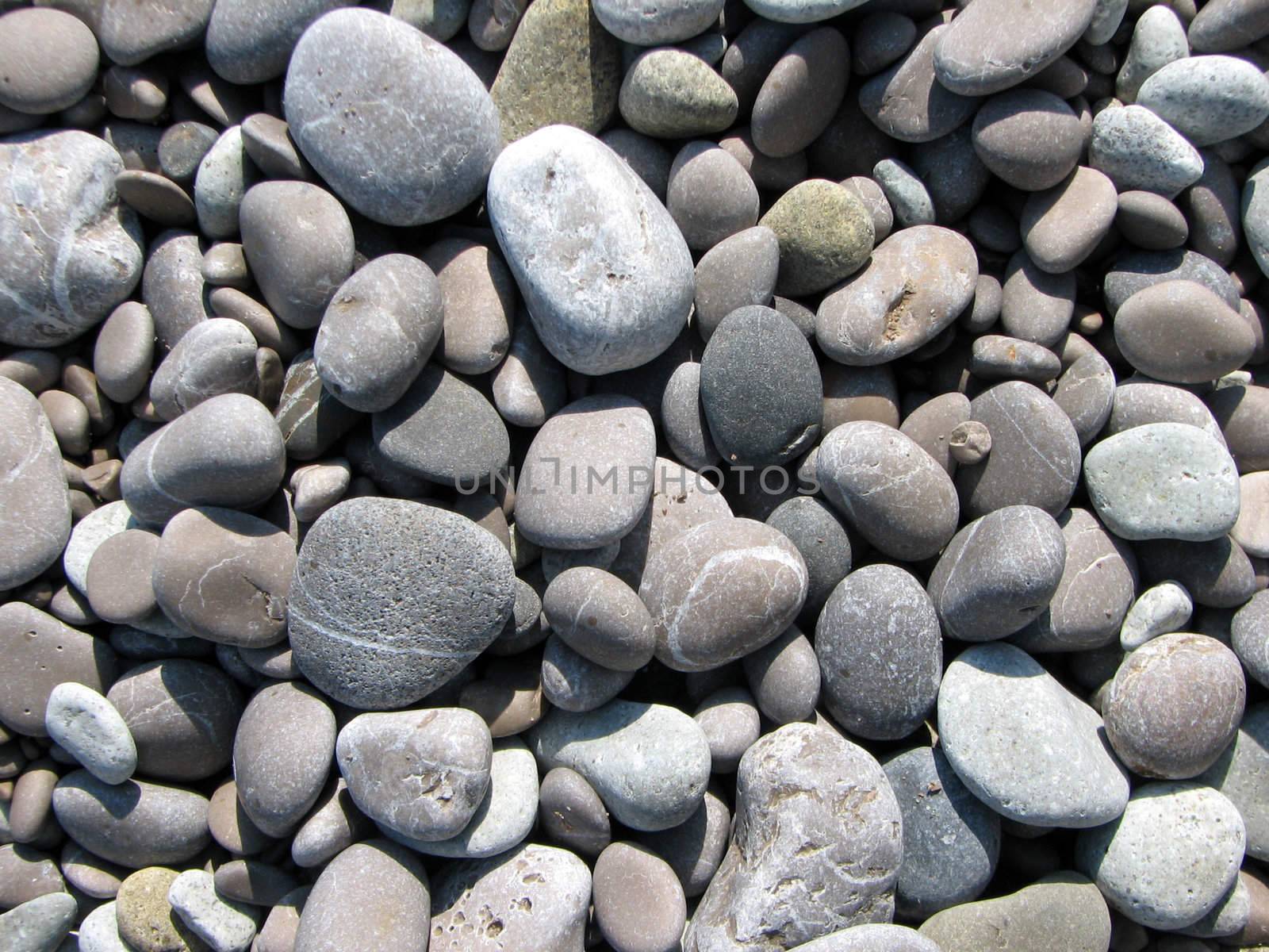 pebbles on the beach of the Black Sea. big picture by acidgrey