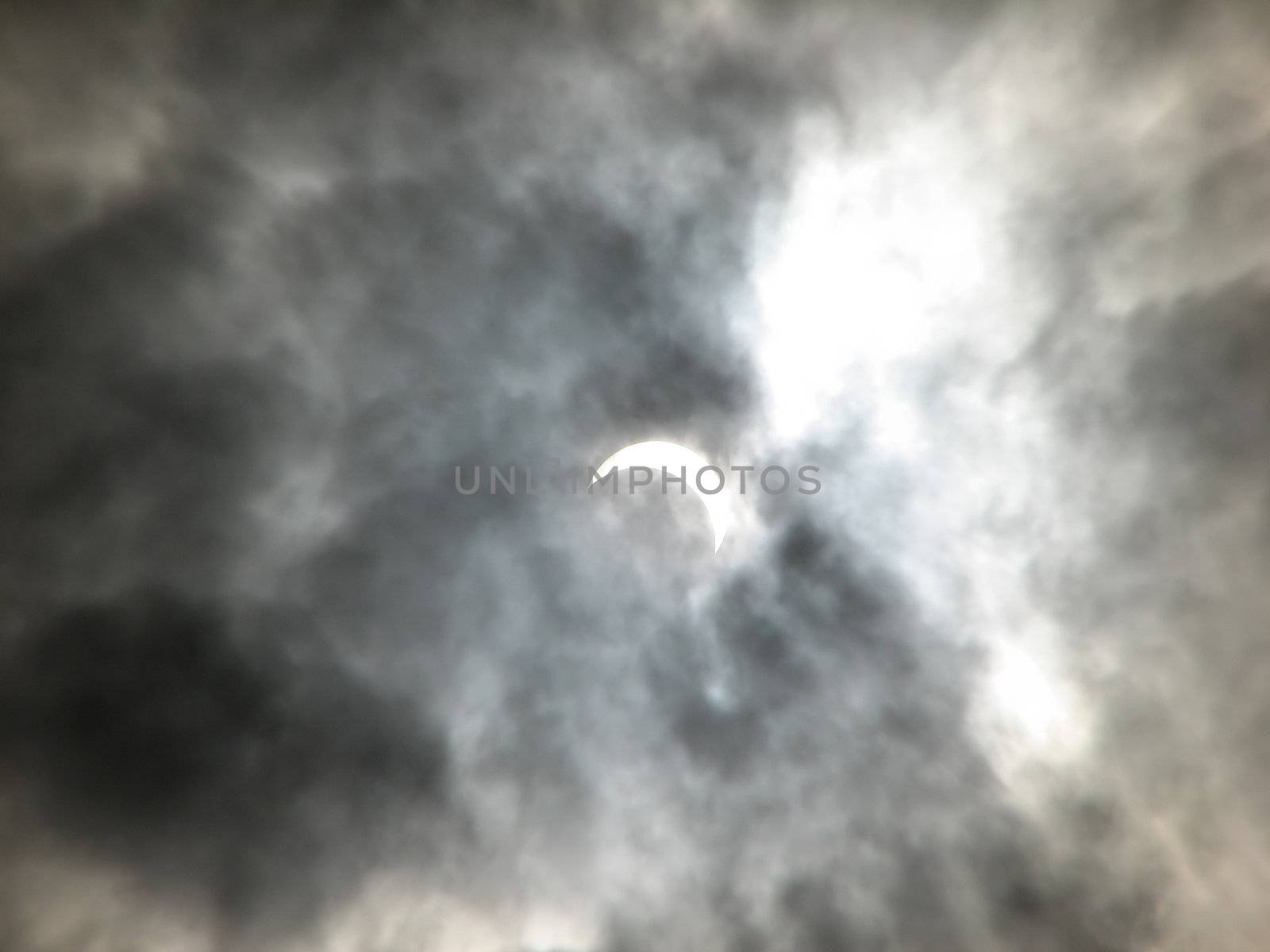 Partial solar eclipse in the clouds. Ukraine. March 29, 2006.  by acidgrey