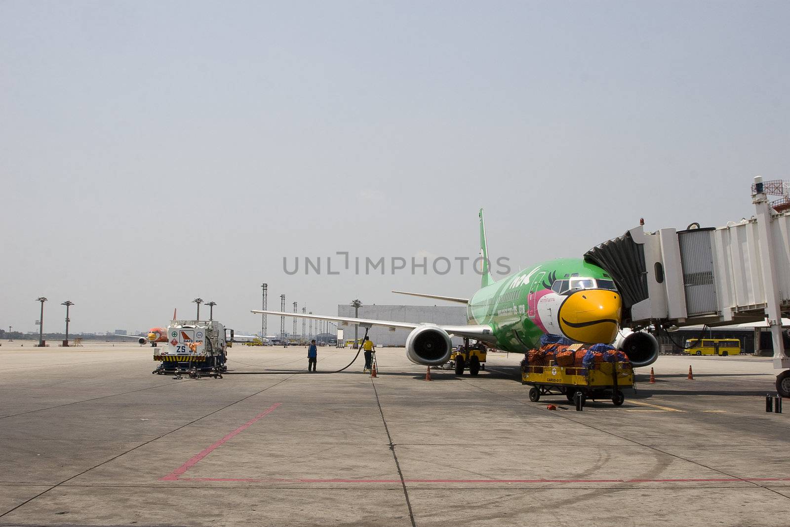Nok Air. One of Thailand's budget airlines is parked for service and maintenance at Bangkok's domestic airport.