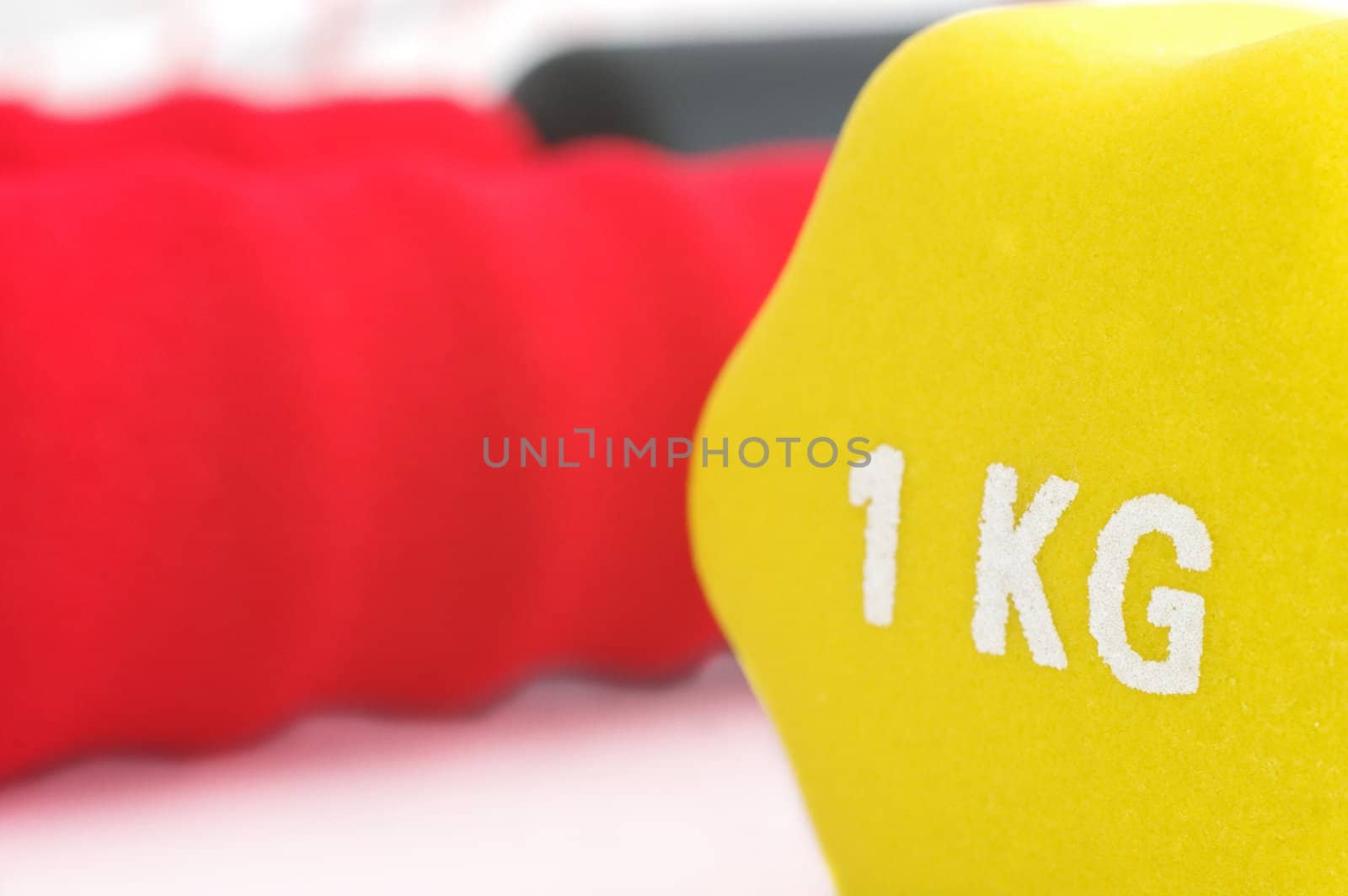 Close up of a one kilogram dumbbell