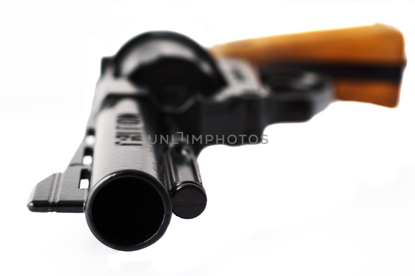 Close-up of a revolver with shallow depth of field isolated on white