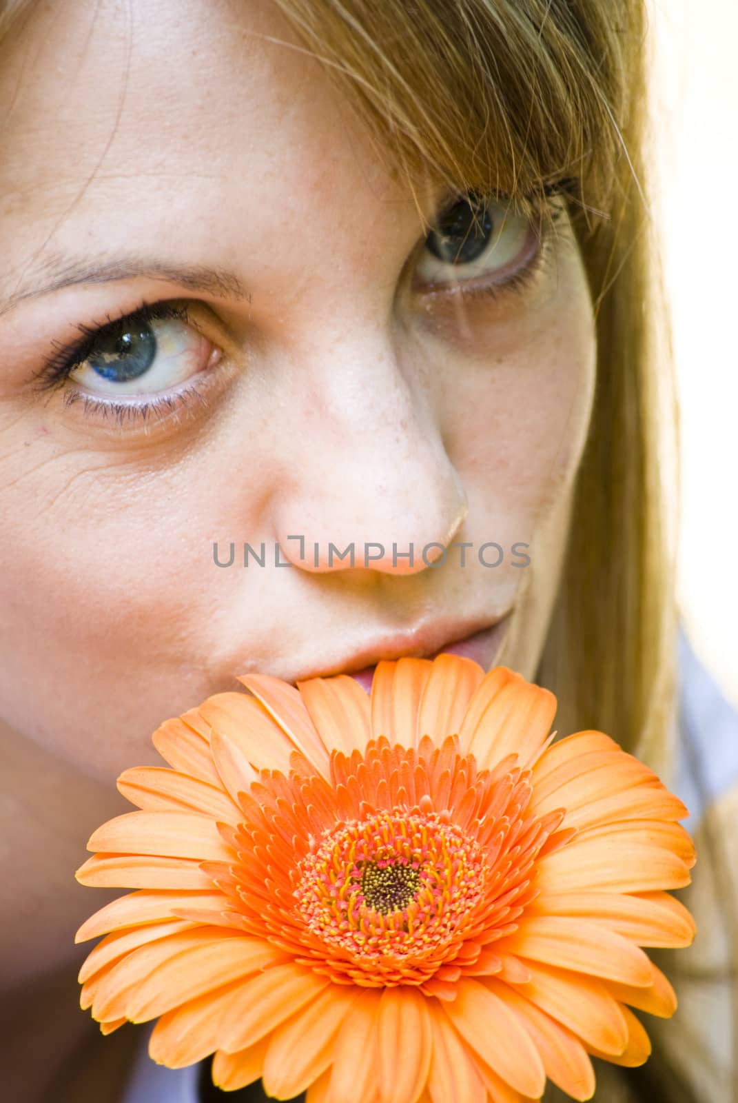 beautiful young blonde woman with flower