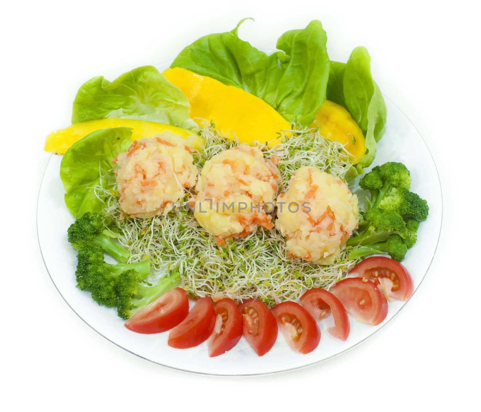 A plate of fresh vegetarian potato salad with fruits and vegetables isolated on white.
