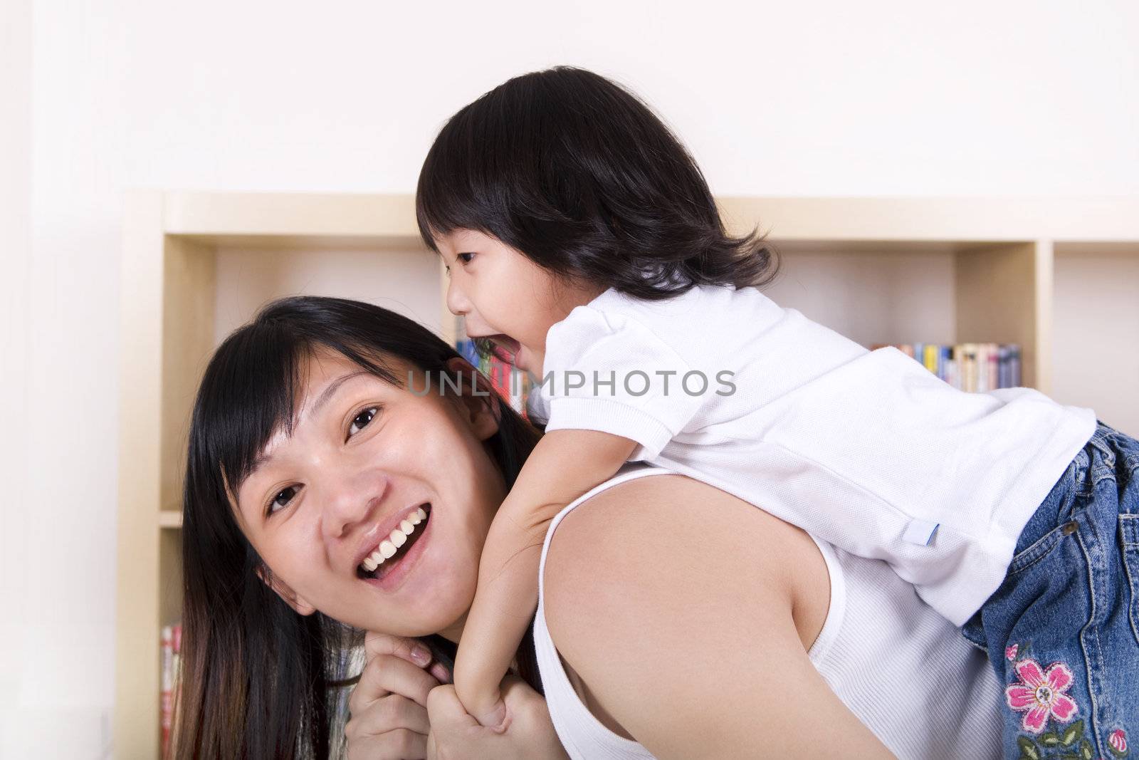 Happy young mother and daughter.