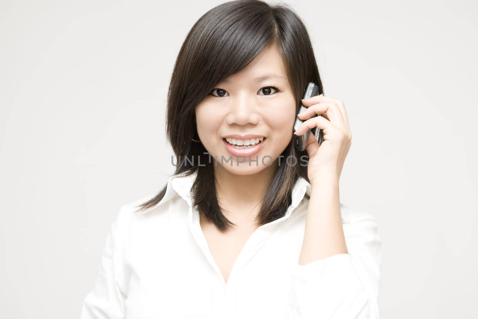 Asian business woman on the phone 
