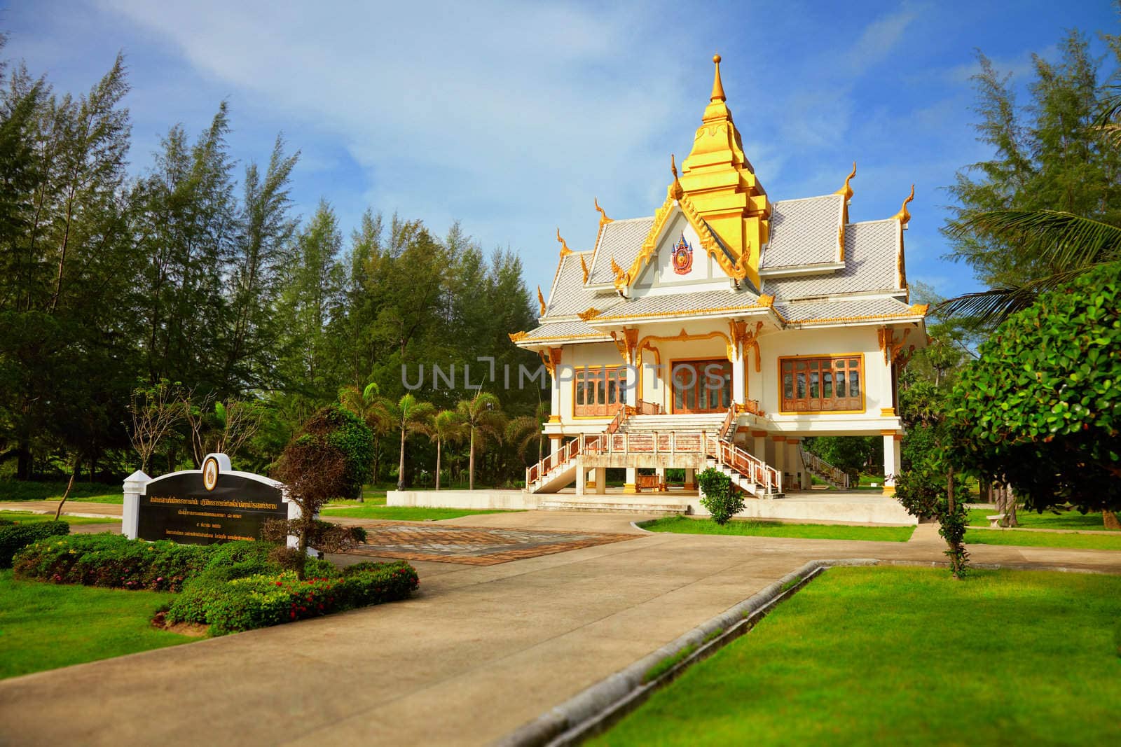 Ancient Buddhist temple among the beautiful tropical vegetation - Thailand, Phuket