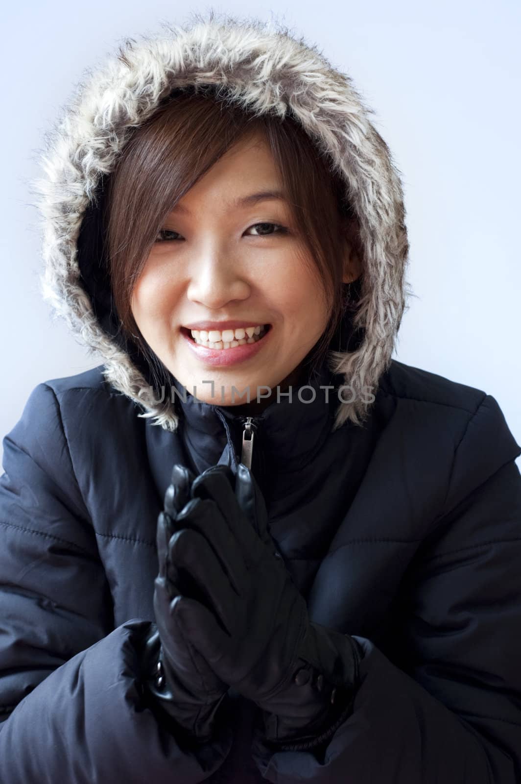 Winter coat girl with her smiling face.