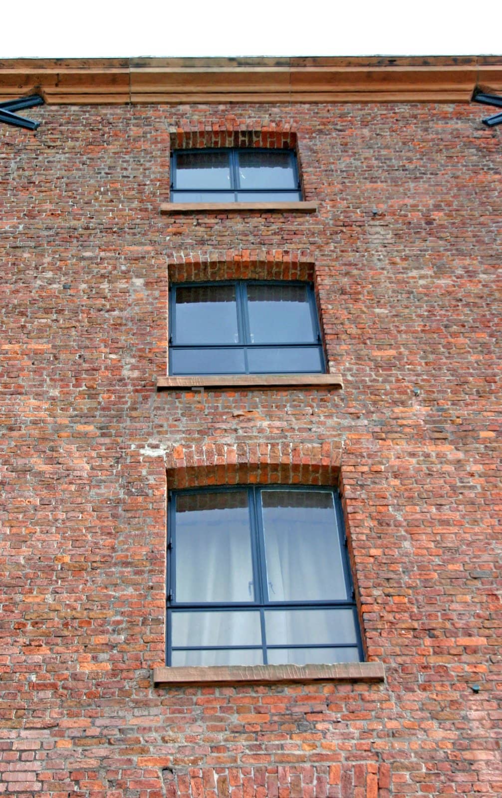 Three Windows in an Old Converted Warehouse