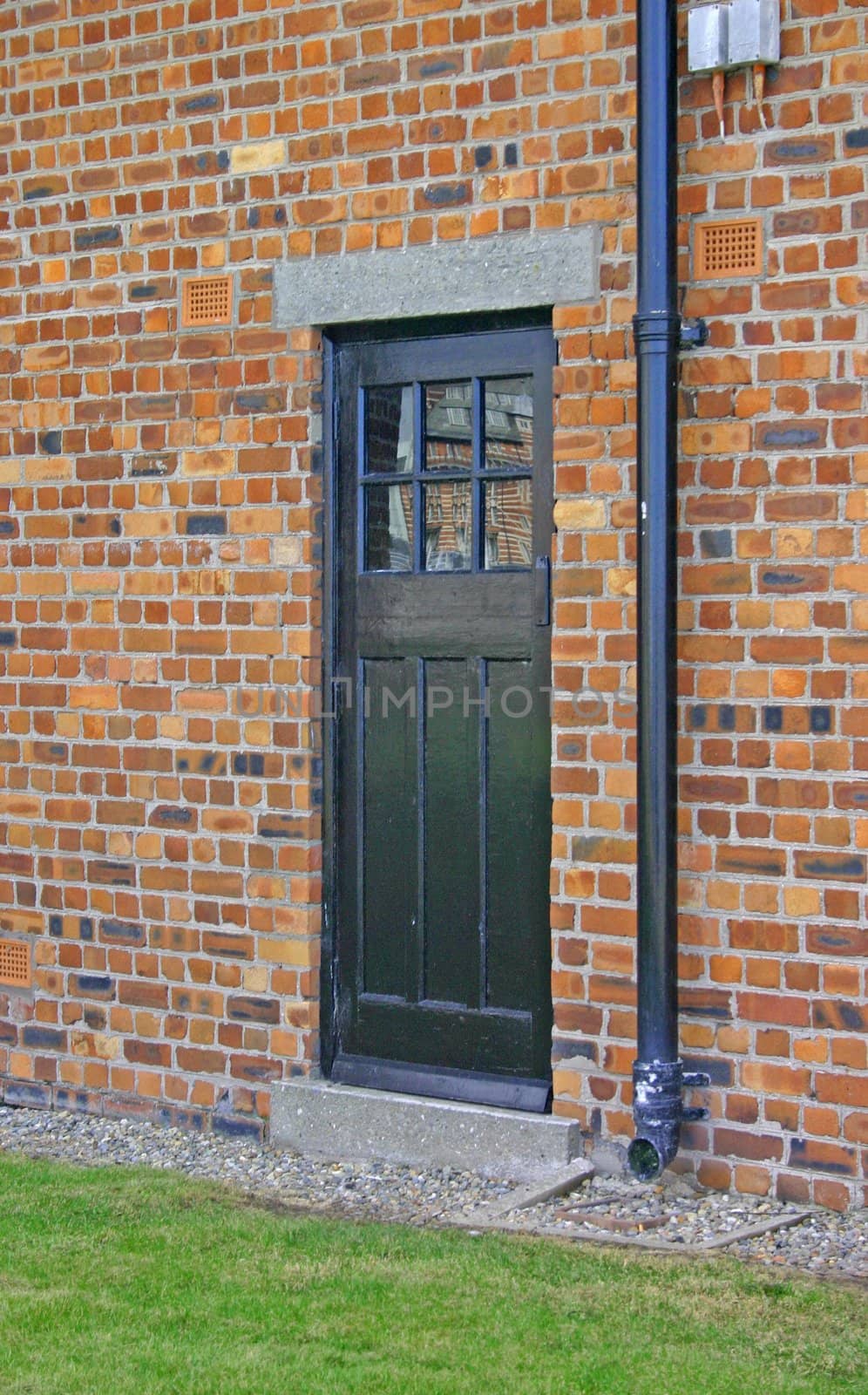 Black Door in Brick Wall