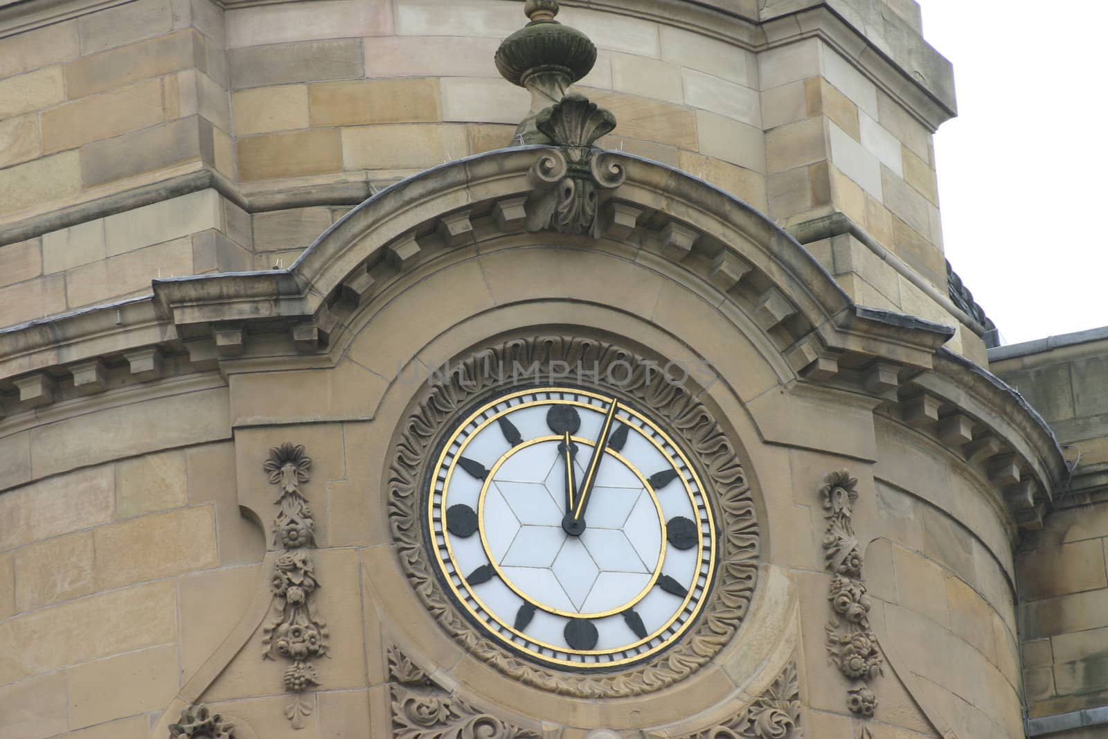 Clock on Old Building Just Past Noon