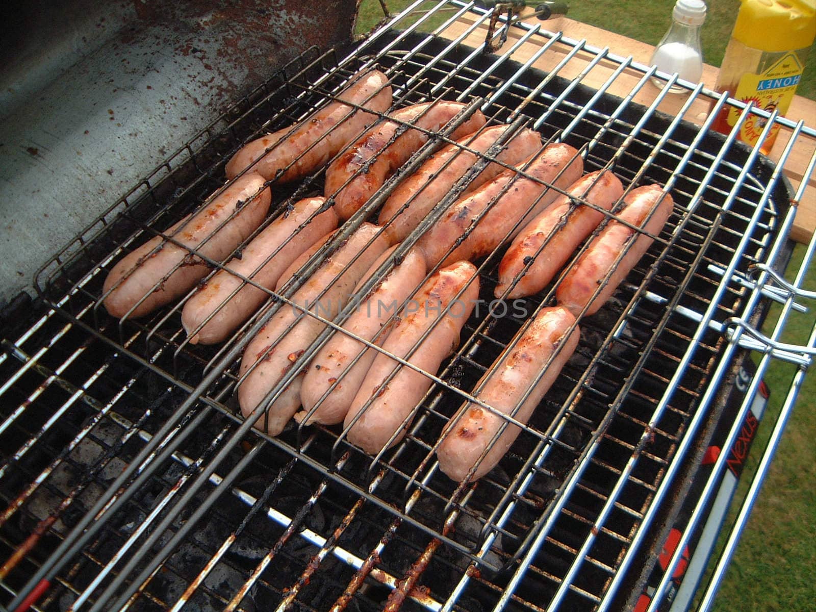 Sausages Cooking on a Barbecue