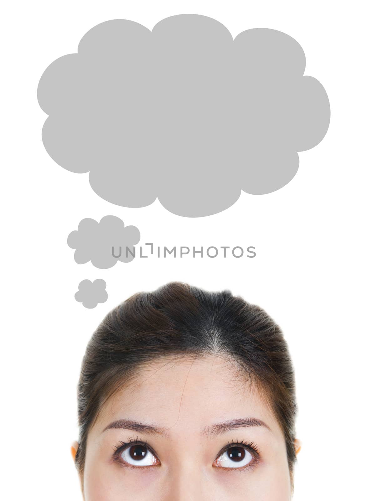 Young Asian woman looking up having thought